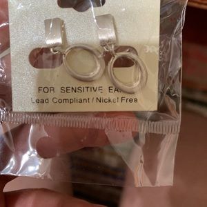 Women’s silver and gold clip on earrings